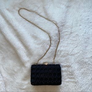 Stylish braided black purse with thick gold chain